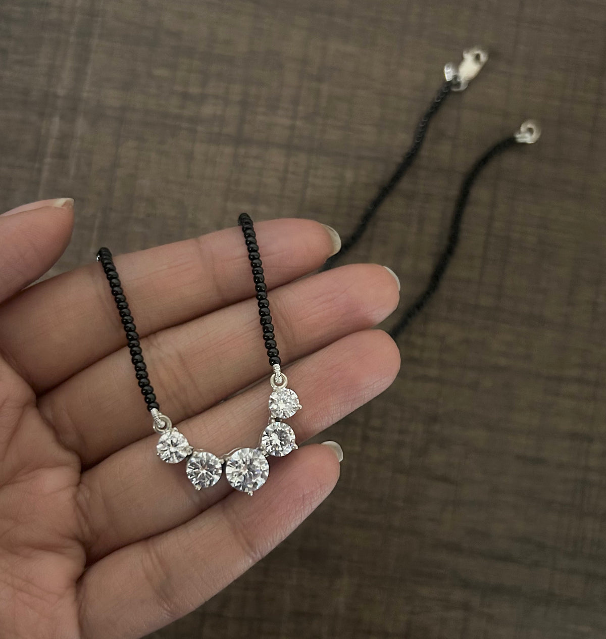 Five cz stone 18'' long mangalsutra with matching 7mm cz studs in pure silver