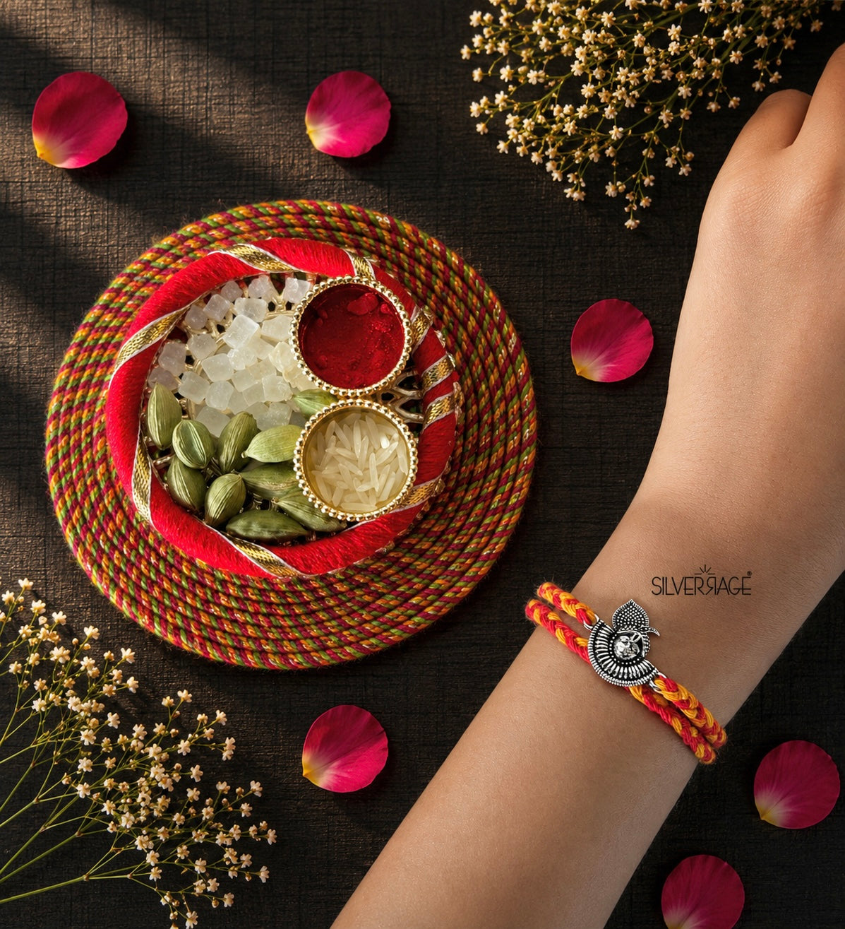 Silver Shreenathji motif rakhi with oxidized finish