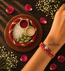 Silver Flower bead with maroon beads rakhi