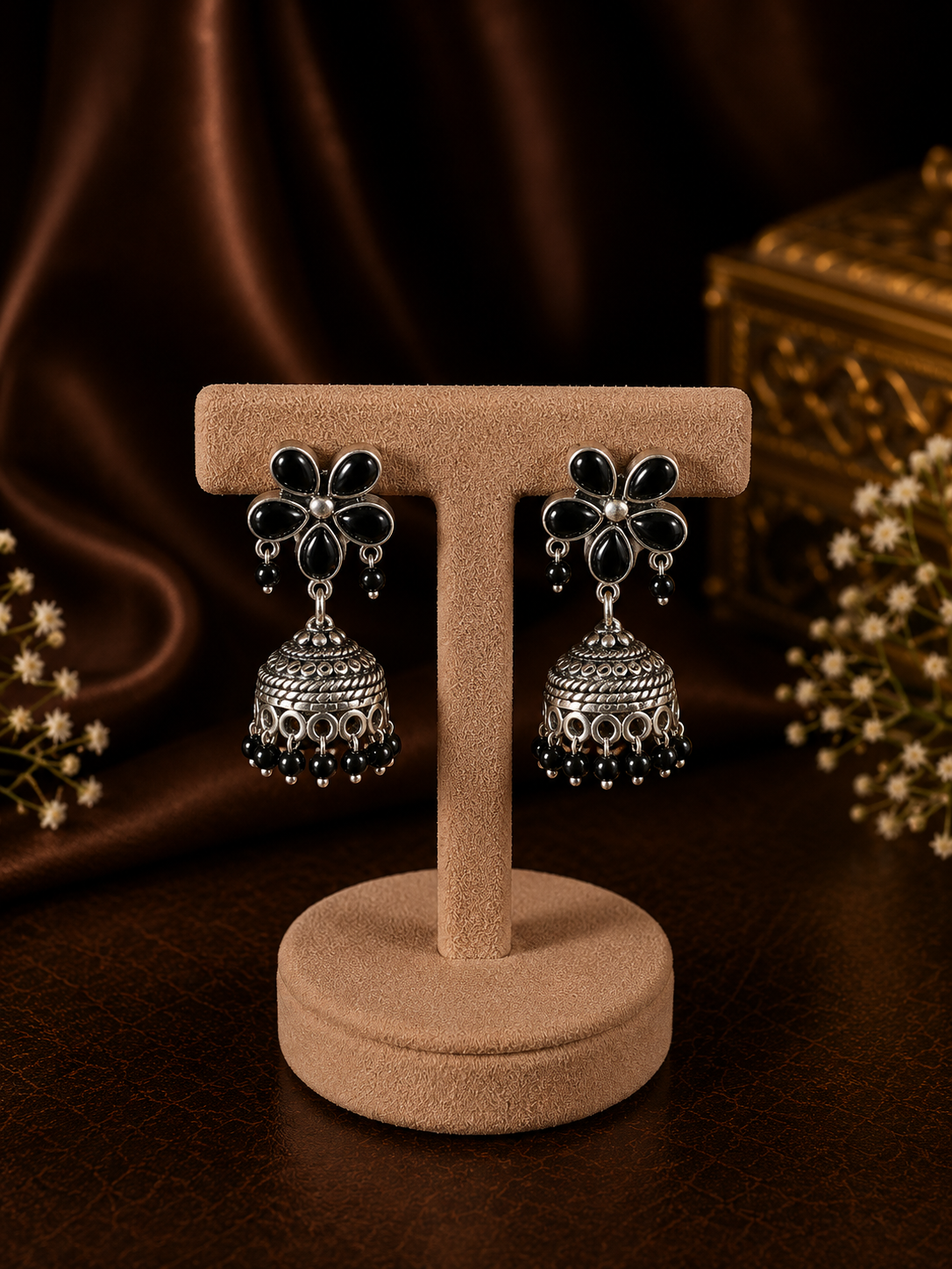 Black onyx flower stud pattern jhumkas in pure silver