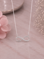 Infinity pattern pendant with cz stones and an 18’’ thin chain in pure silver