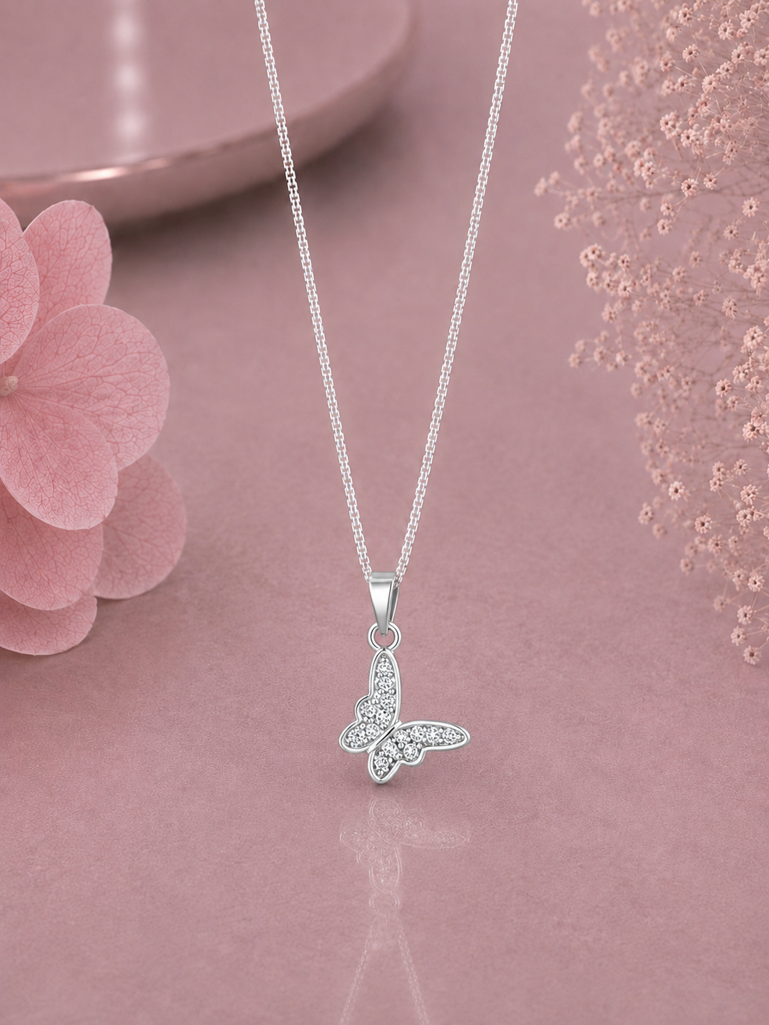 Butterfly pendant with cz stones with an 18 inch chain in pure silver