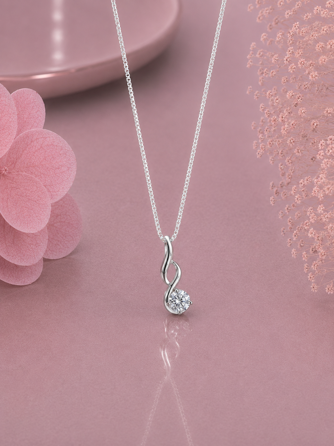 6mm single stone double paisley pendant with an 18’’ chain in pure silver