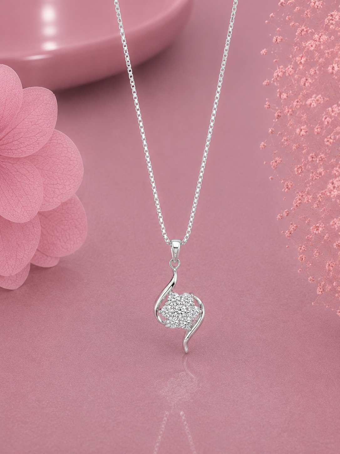 Six petal cz stone flower pattern with curved ends and an 18'' chain in pure silver