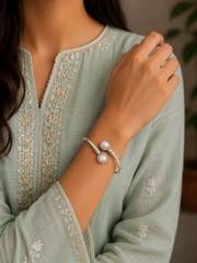 Round rava pattern natural pearl center twisted kada in pure silver