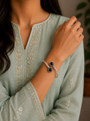 Round rava pattern natural black cabstone twisted kada in pure silver