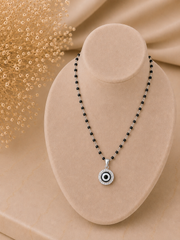 1.2 cm diameter multi cz stone studded evil eye pendant with an 18'' mangalsutra chain in pure silver