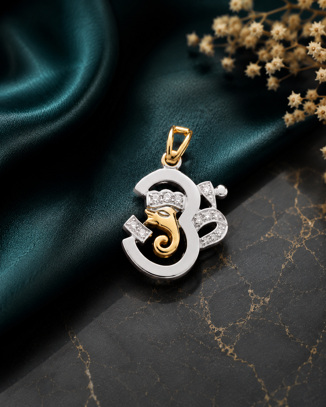 Two tone Om-Ganesha motif pendant with 22 kt. gold plating, a rudraksh in pure silver