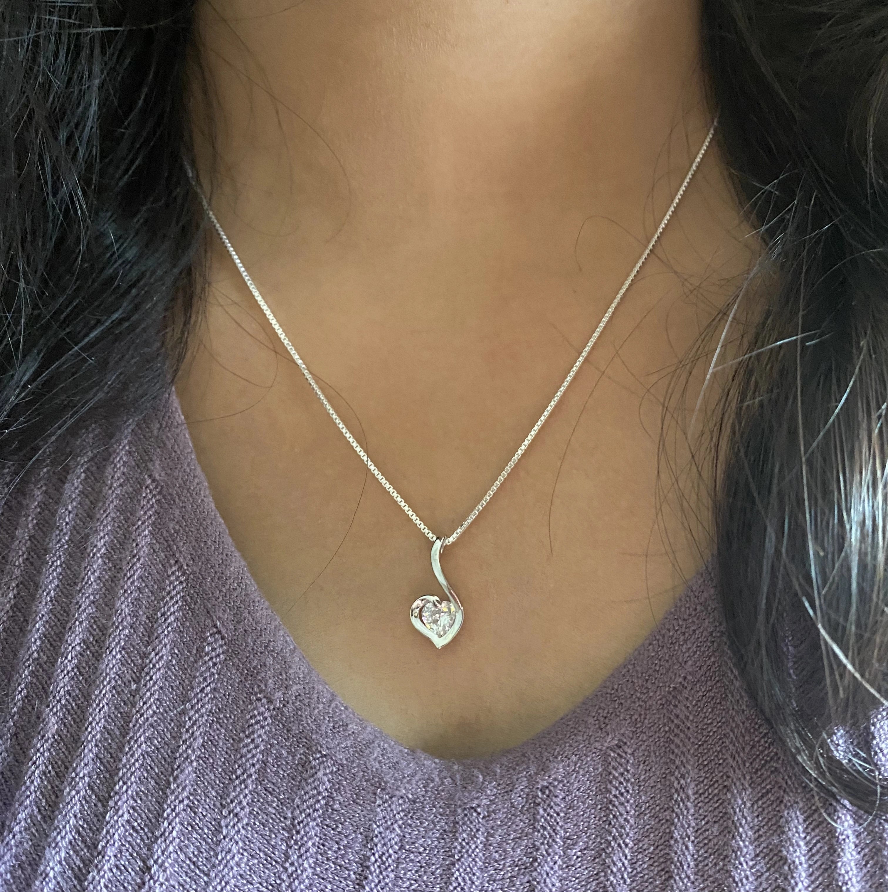 Paisley heart pendant with a single cz stone along with an 18'' chain in pure silver