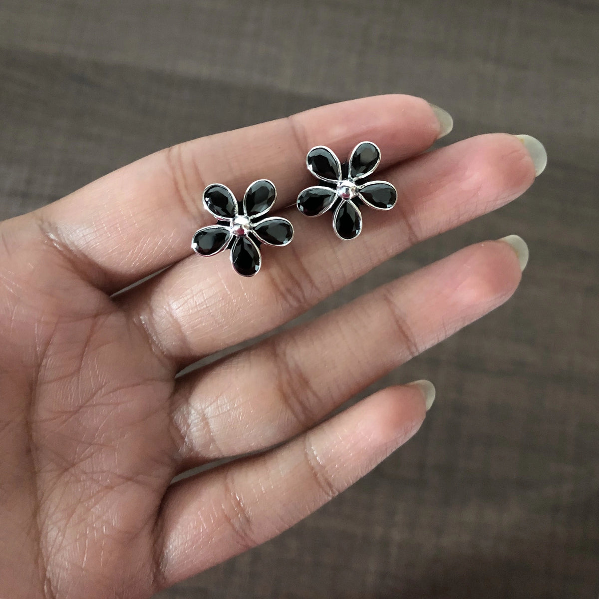Black cz cut stone flower studs in pure silver