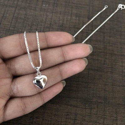 Hollow heart motif pendant with an 18'' chain in pure silver