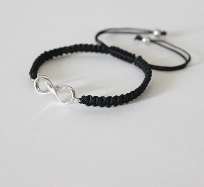 Infinity motif adjustable hand braided bracelet made in pure silver