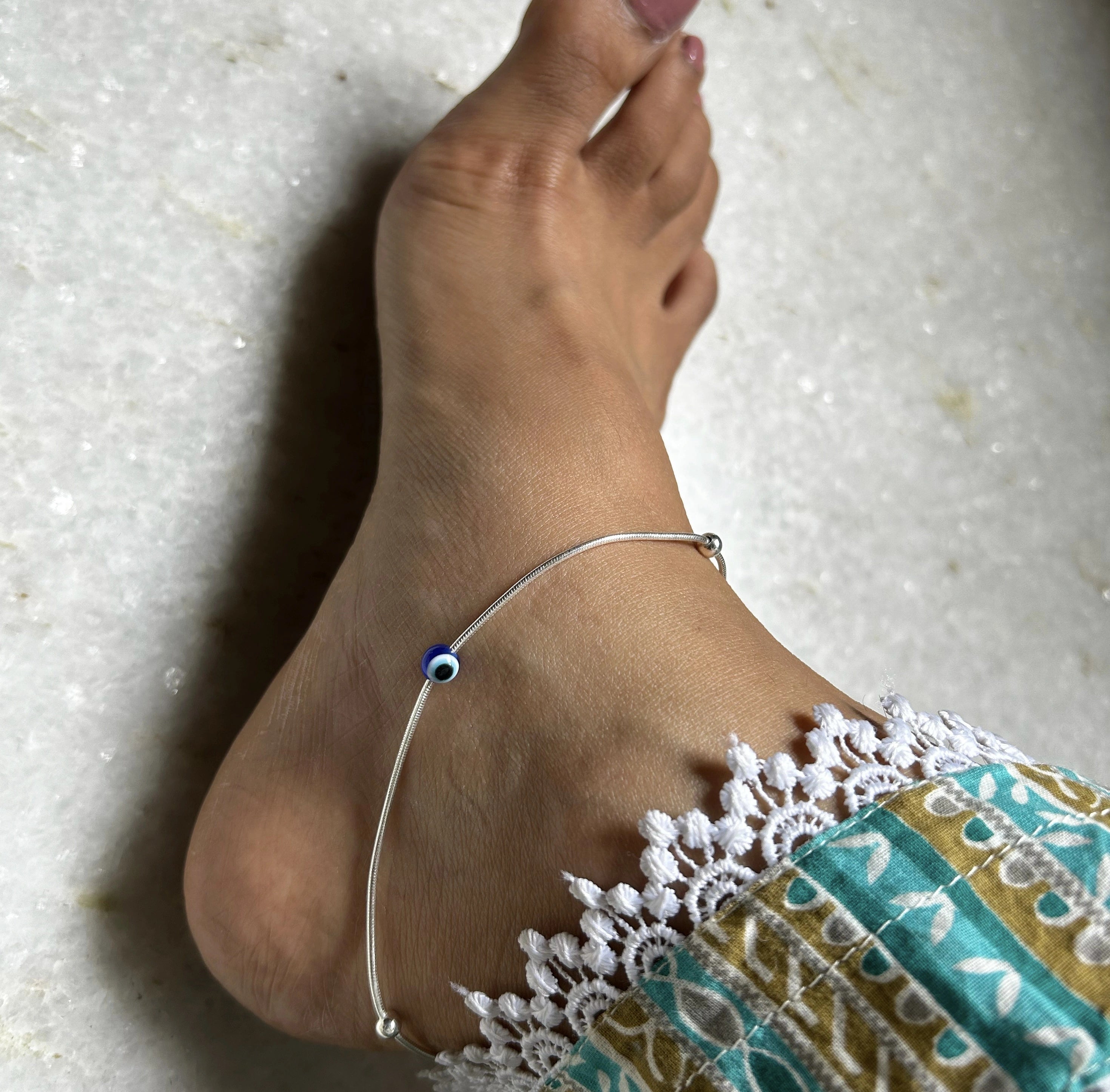 Tiny evil eye bead adjustable anklet in pure silver