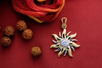 Surya motif with a cz stone pendant and 22 kt gold plating set in pure silver